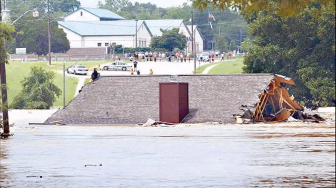 Floodwaters surrounding buildings in the Texas Hill Country